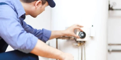 plumber-inspecting-water-heater-tank-westerville-oh plumber inspecting water heater tank in Columbus, Ohio Water Heaters provides water heaters installations, repair and replacement.